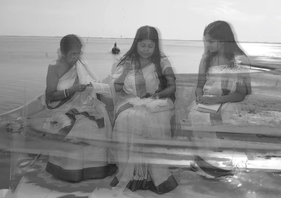 Three seated women layered over a wide river with a small boat, in black and white, a moving-image still from To Mend What Does Not Return